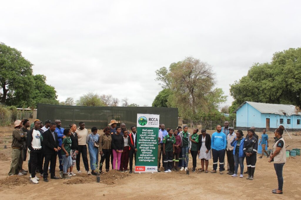 Doing a tree planting at the nursery center